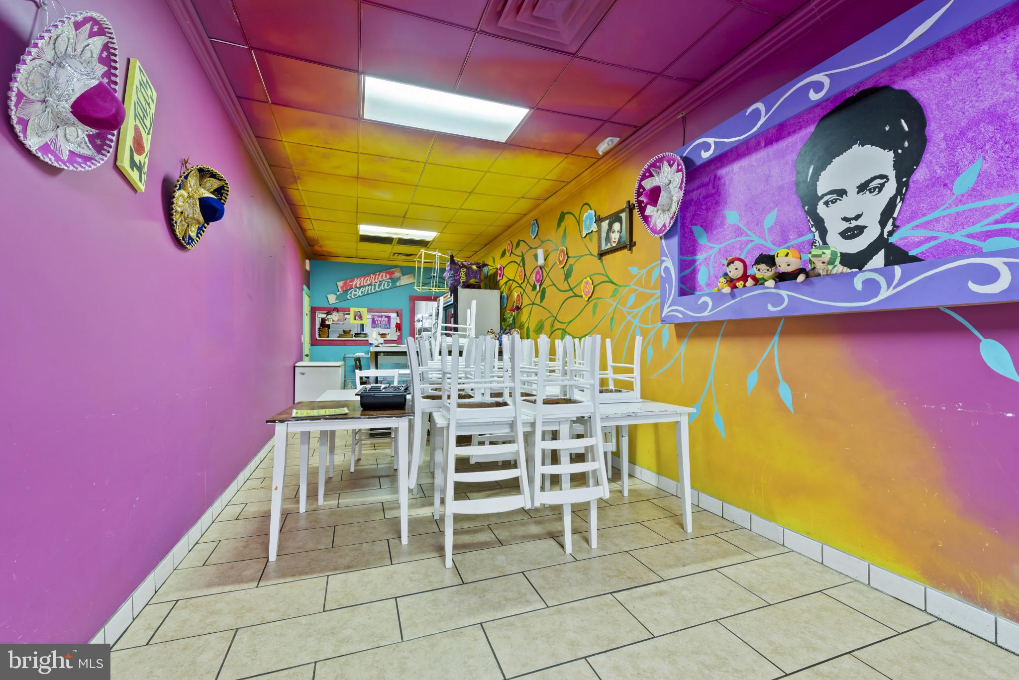 3418 Eastern Avenue Baltimore, MD 21224 - Photo 17 of 53 a view of a room with table and chairs