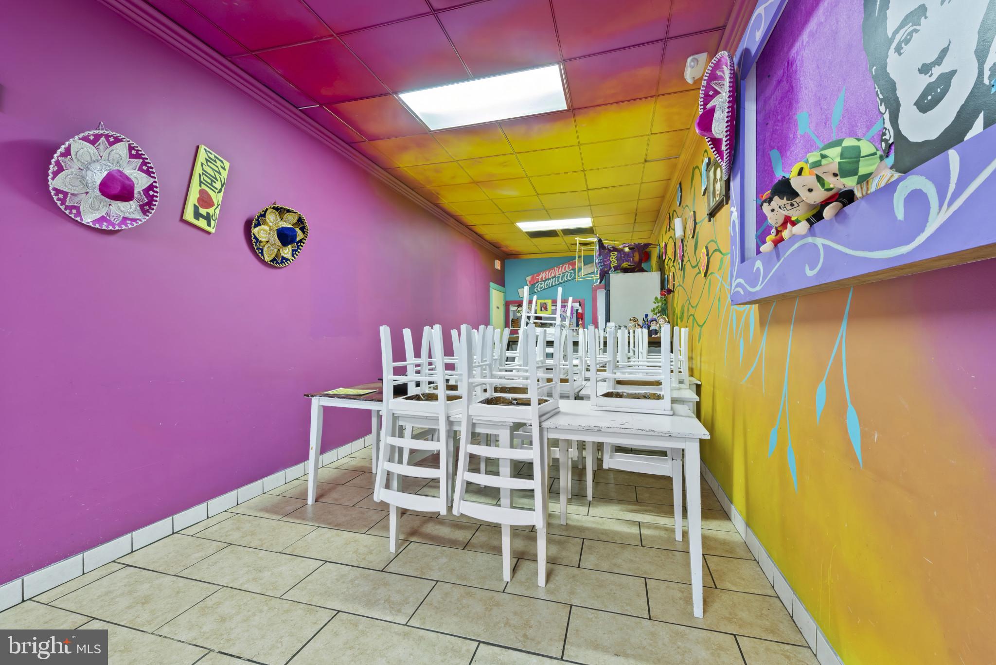 3418 Eastern Avenue Baltimore, MD 21224 - Photo 18 of 53 a view of a dining room with furniture