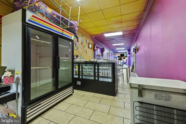 a kitchen with stainless steel appliances granite countertop a stove and cabinets