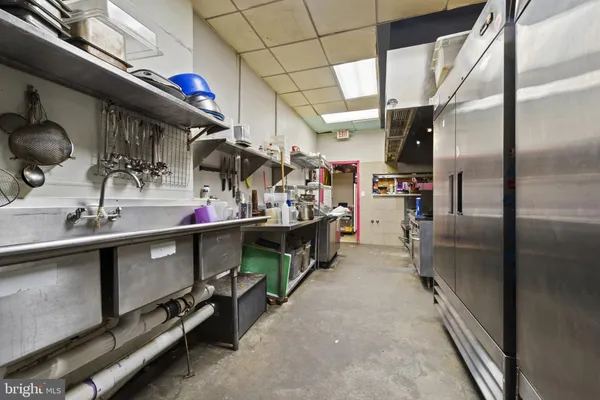 a view of a kitchen cabinets and wooden floor