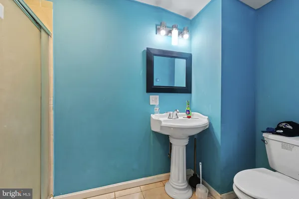 a kitchen with kitchen island a sink appliances and cabinets