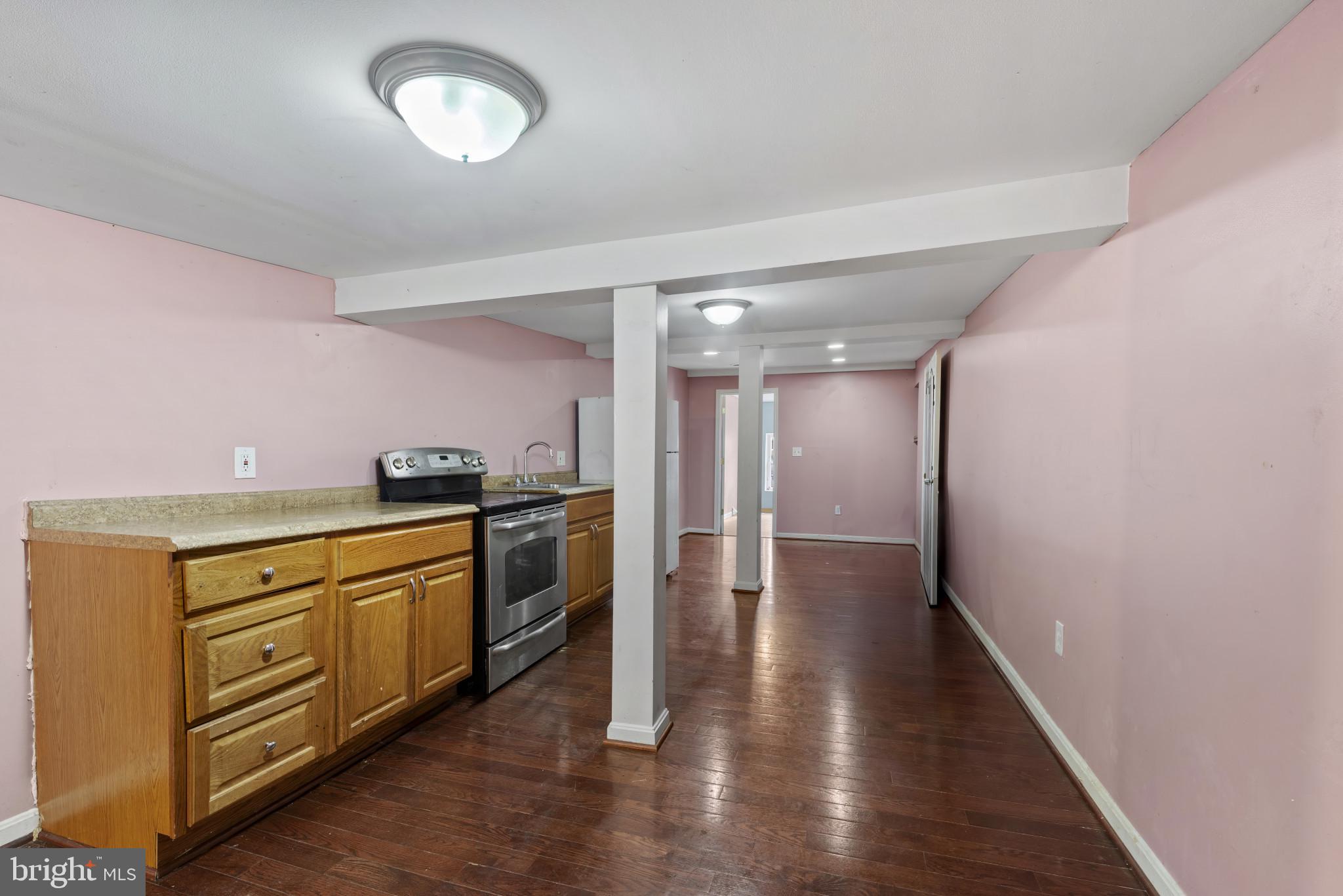3418 Eastern Avenue Baltimore, MD 21224 - Photo 37 of 53 a view of a kitchen cabinets and wooden floor