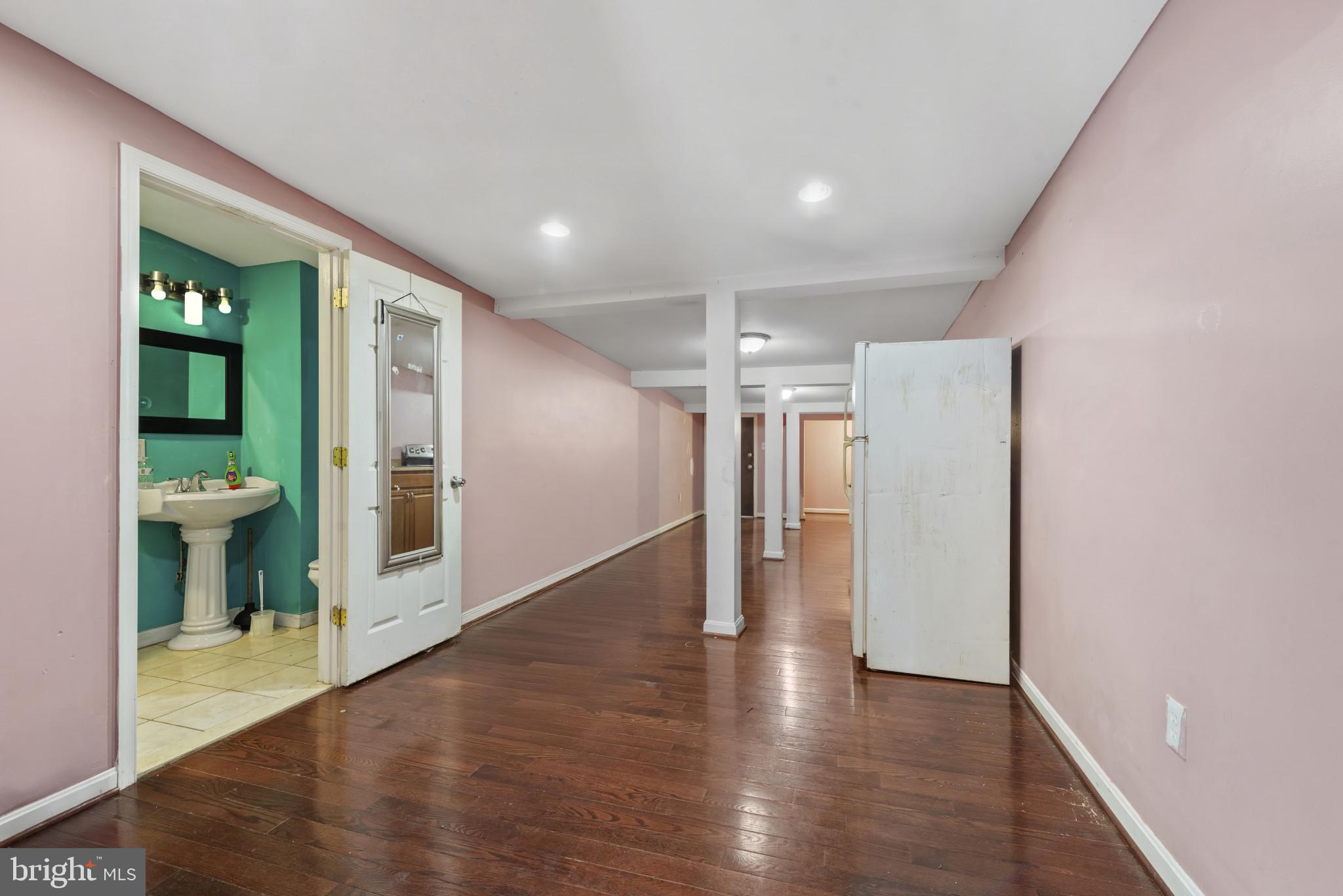 3418 Eastern Avenue Baltimore, MD 21224 - Photo 43 of 53 a view of a hallway with wooden floor