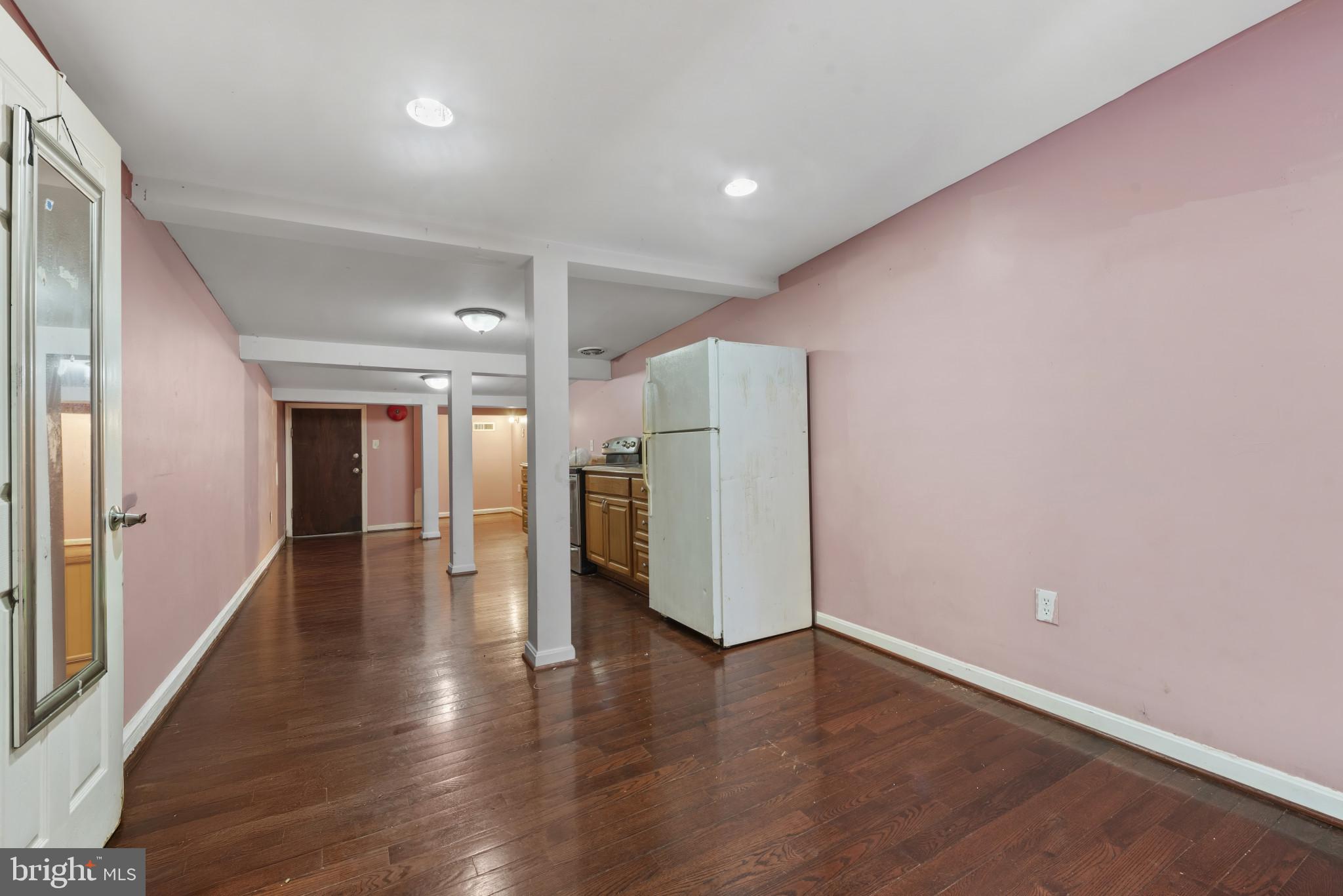 3418 Eastern Avenue Baltimore, MD 21224 - Photo 44 of 53 an empty room with wooden floor and windows