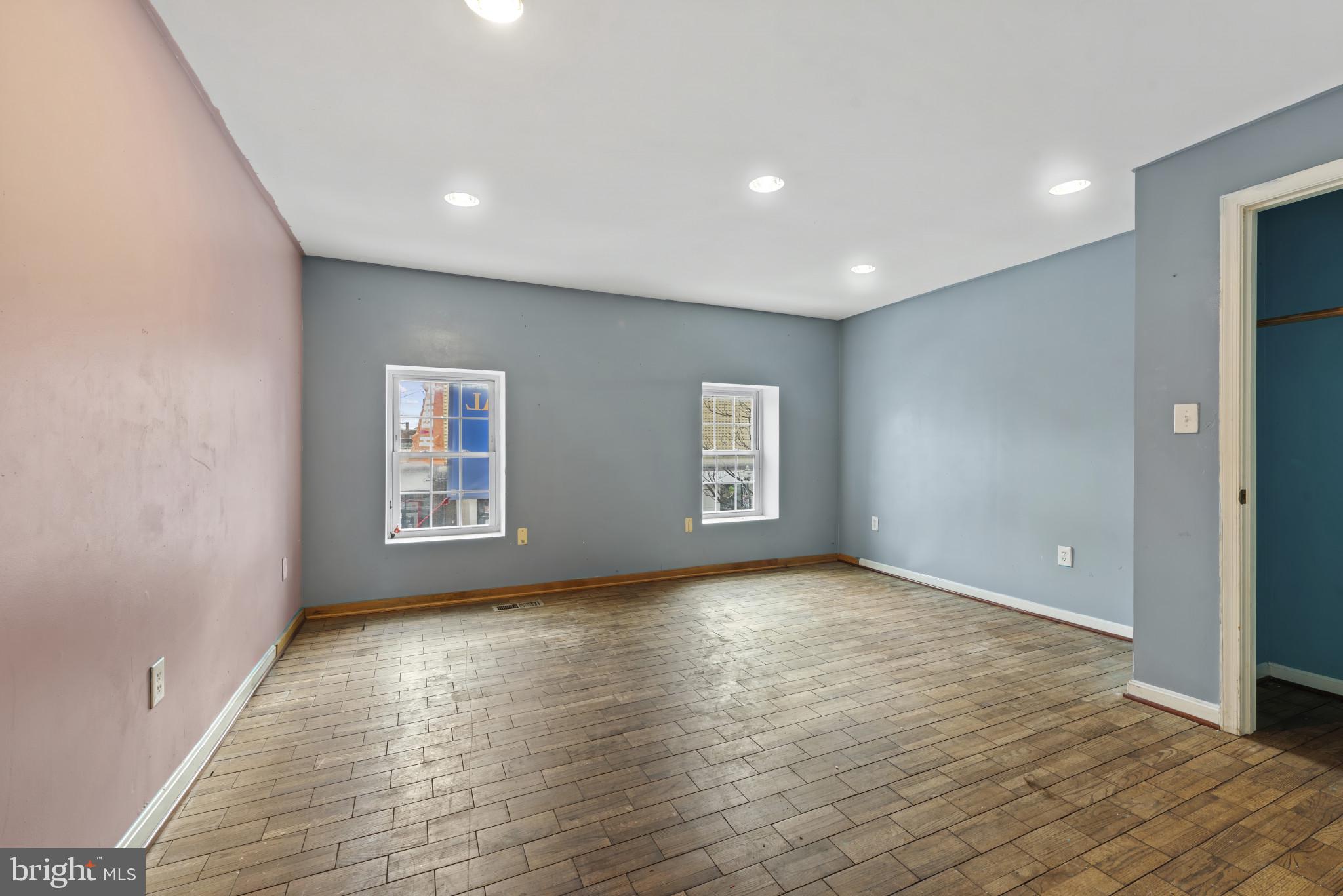 3418 Eastern Avenue Baltimore, MD 21224 - Photo 45 of 53 wooden floor in an empty room with a window