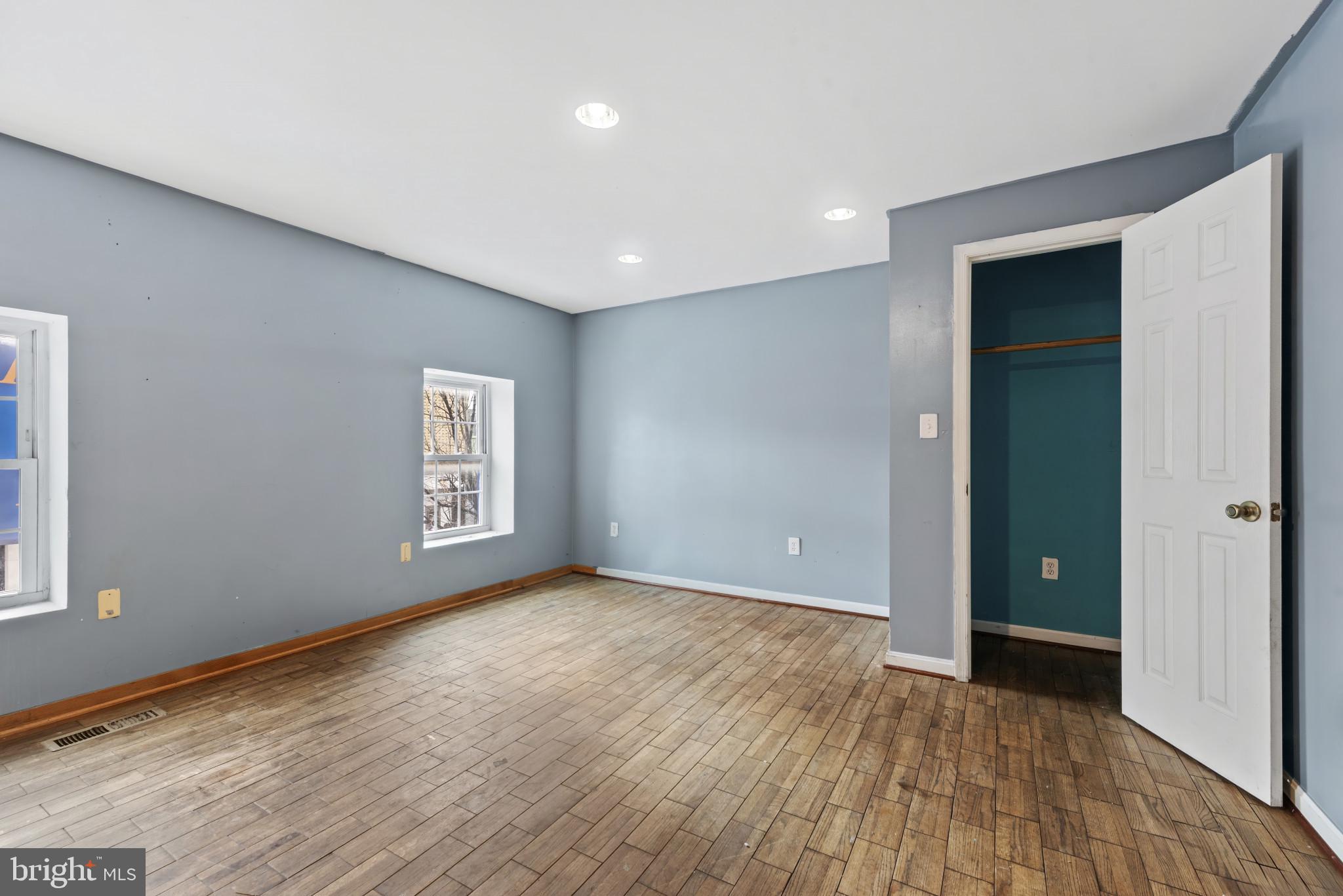 3418 Eastern Avenue Baltimore, MD 21224 - Photo 46 of 53 a view of an empty room with wooden floor and closet