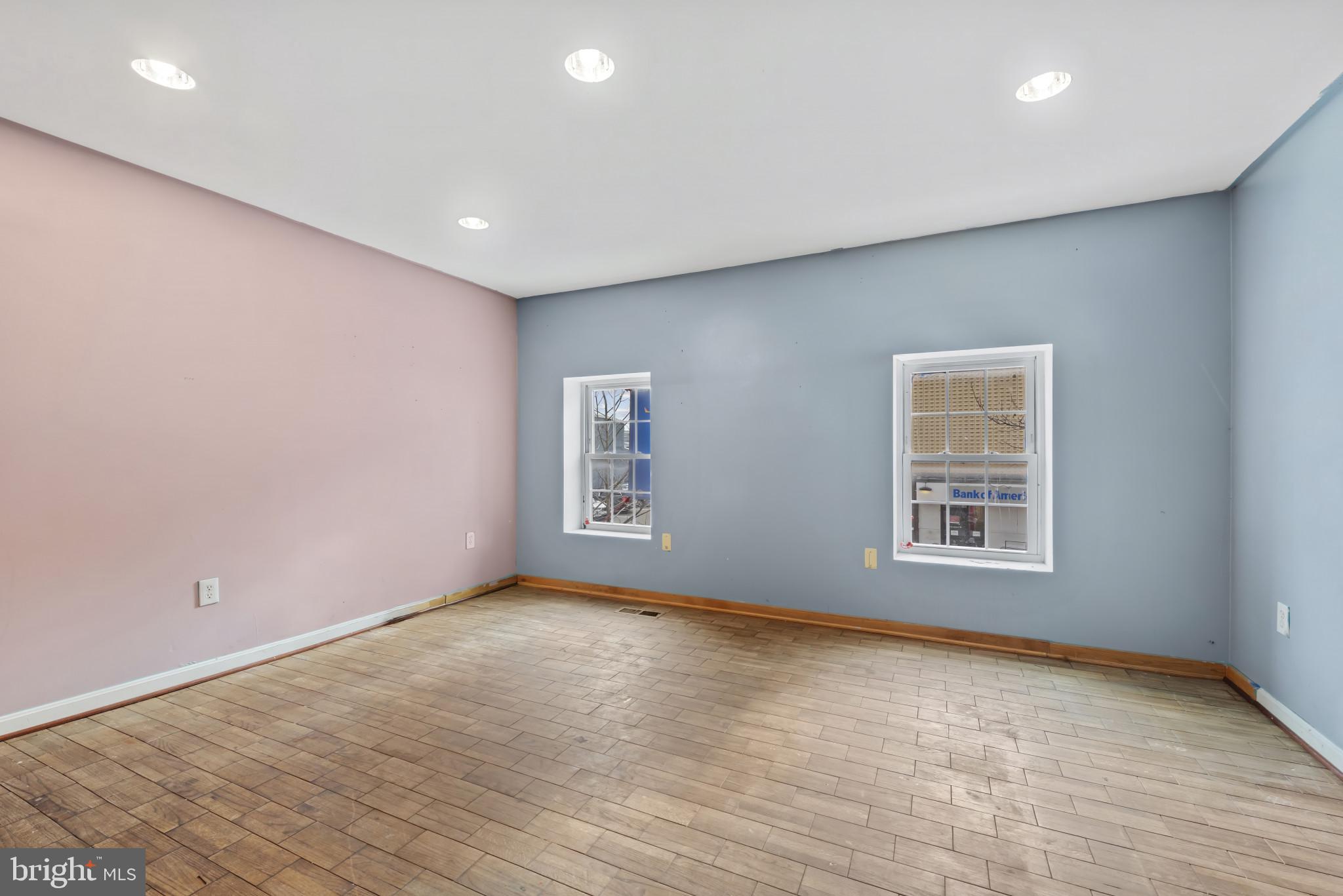 3418 Eastern Avenue Baltimore, MD 21224 - Photo 49 of 53 a view of empty room with wooden floor and fan