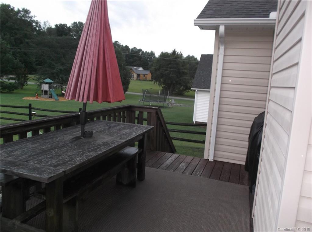136 Maple Ridge Circle Salisbury, NC 28147 - Photo 11 of 23 a view of a wooden deck with a backyard