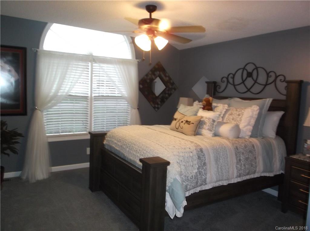 136 Maple Ridge Circle Salisbury, NC 28147 - Photo 20 of 23 a bed sitting in a bedroom next to a window