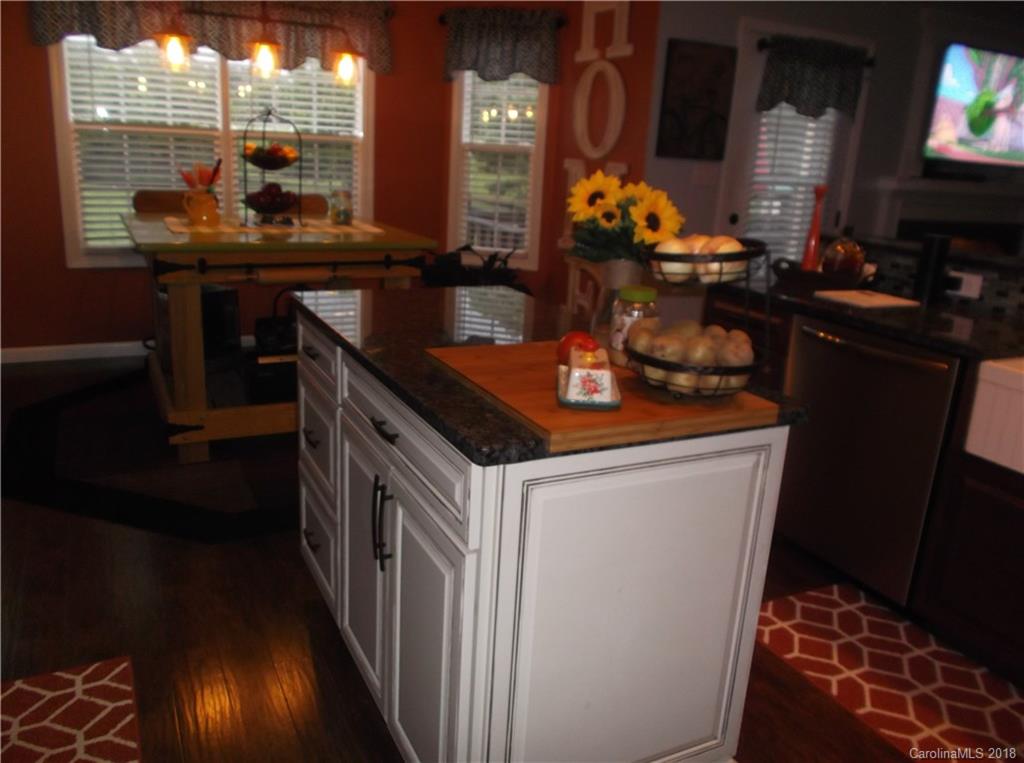 136 Maple Ridge Circle Salisbury, NC 28147 - Photo 21 of 23 a kitchen with stainless steel appliances granite countertop a stove and a sink