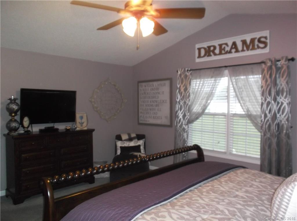136 Maple Ridge Circle Salisbury, NC 28147 - Photo 23 of 23 a bedroom with furniture and a flat screen tv