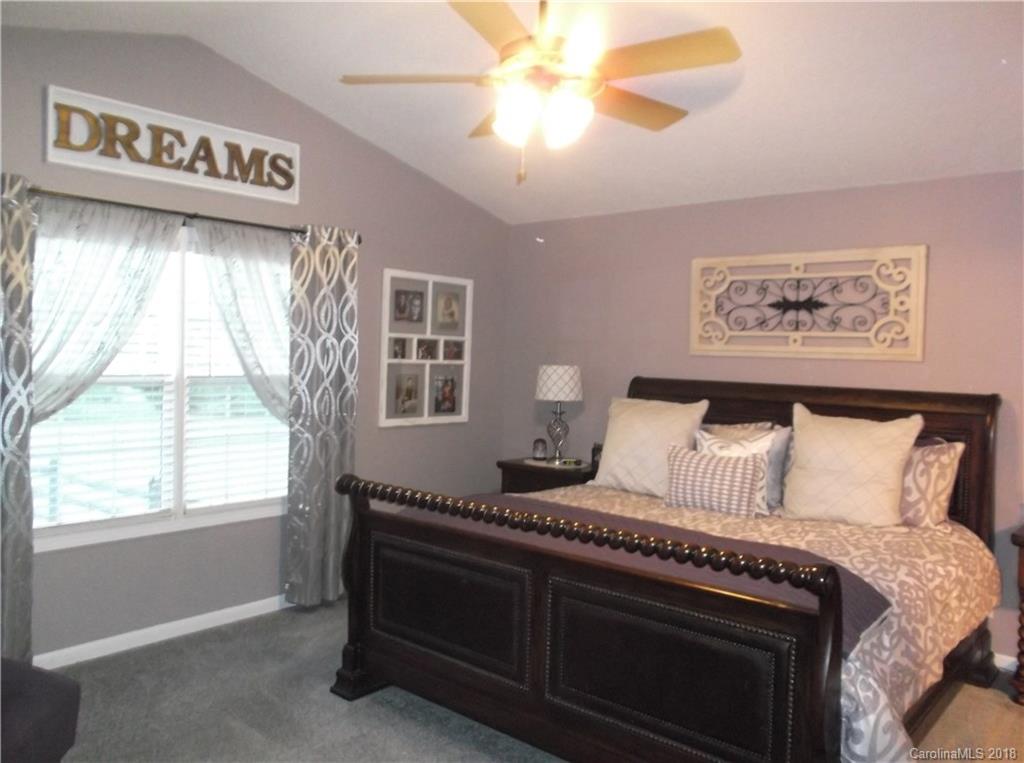 136 Maple Ridge Circle Salisbury, NC 28147 - Photo 4 of 23 a bedroom with a bed and a window