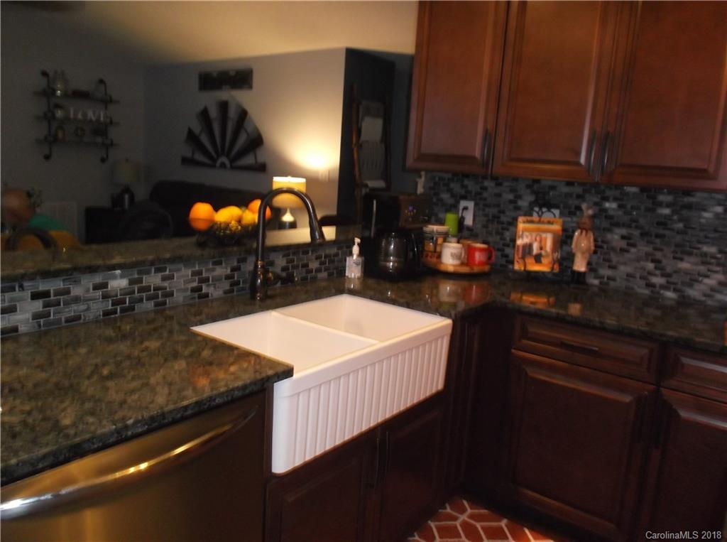 136 Maple Ridge Circle Salisbury, NC 28147 - Photo 8 of 23 a kitchen with a sink and cabinets
