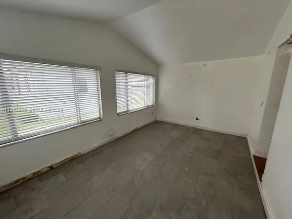 an empty room with windows