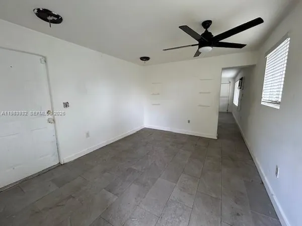 a view of a big room with carpet