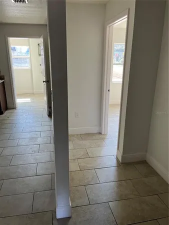 a view of an entryway with wooden floor and a window