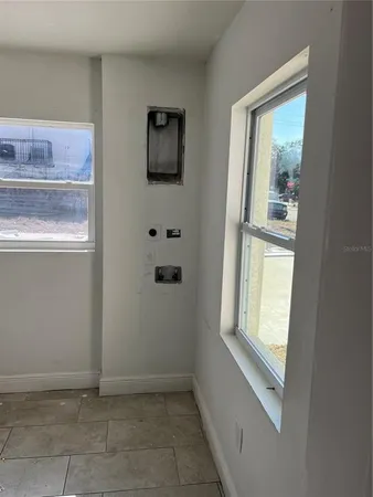 a view of an empty room with a sink