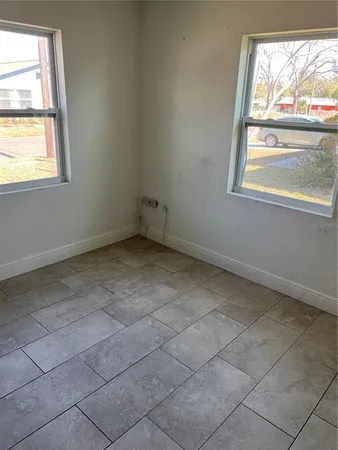 a kitchen with a cabinets and white appliances