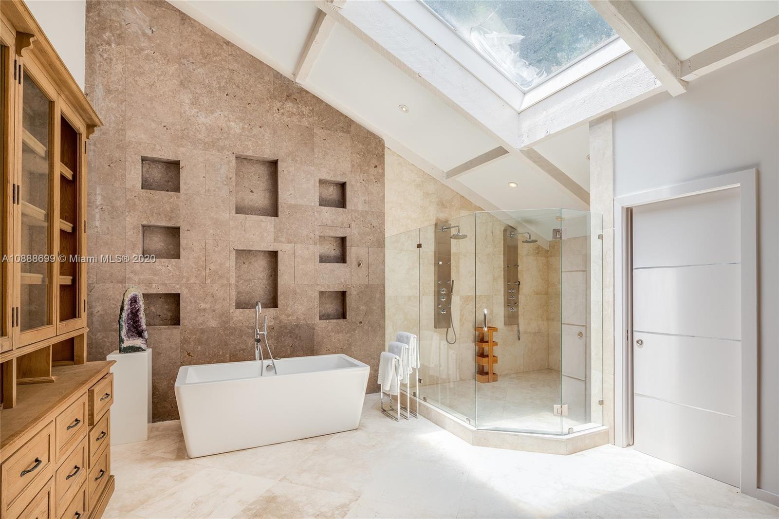 621 Island Road Miami, FL 33137 - Photo 17 of 39 a bathroom with a tub shower and sink