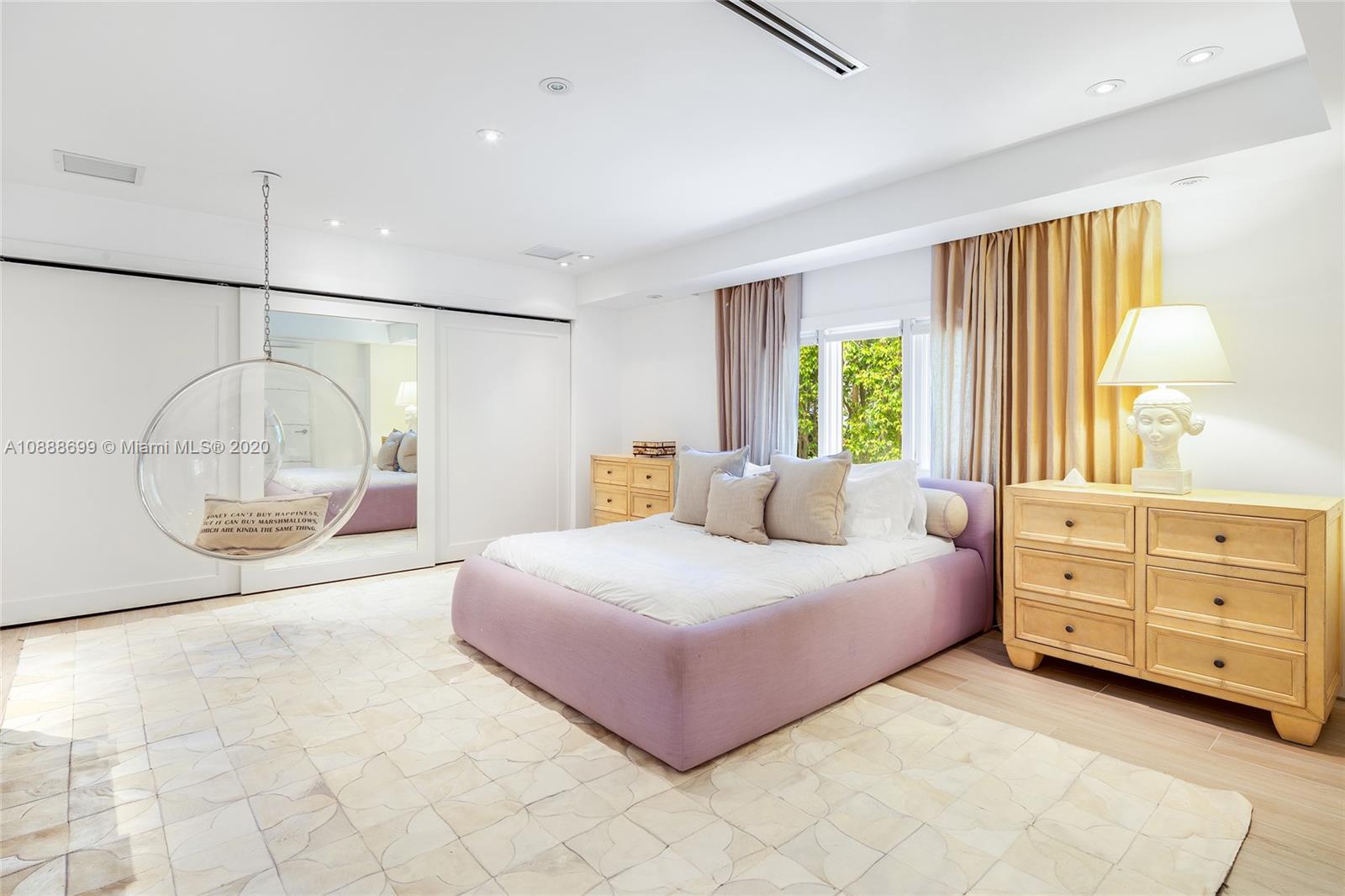 621 Island Road Miami, FL 33137 - Photo 22 of 39 a bedroom with a bed and a mirror