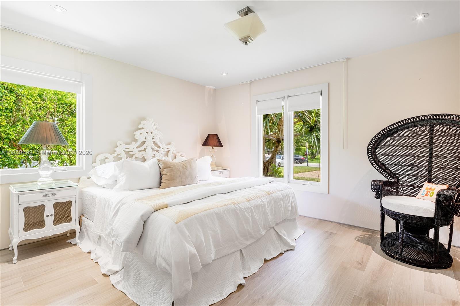 621 Island Road Miami, FL 33137 - Photo 24 of 39 a bedroom with a bed a table and chair