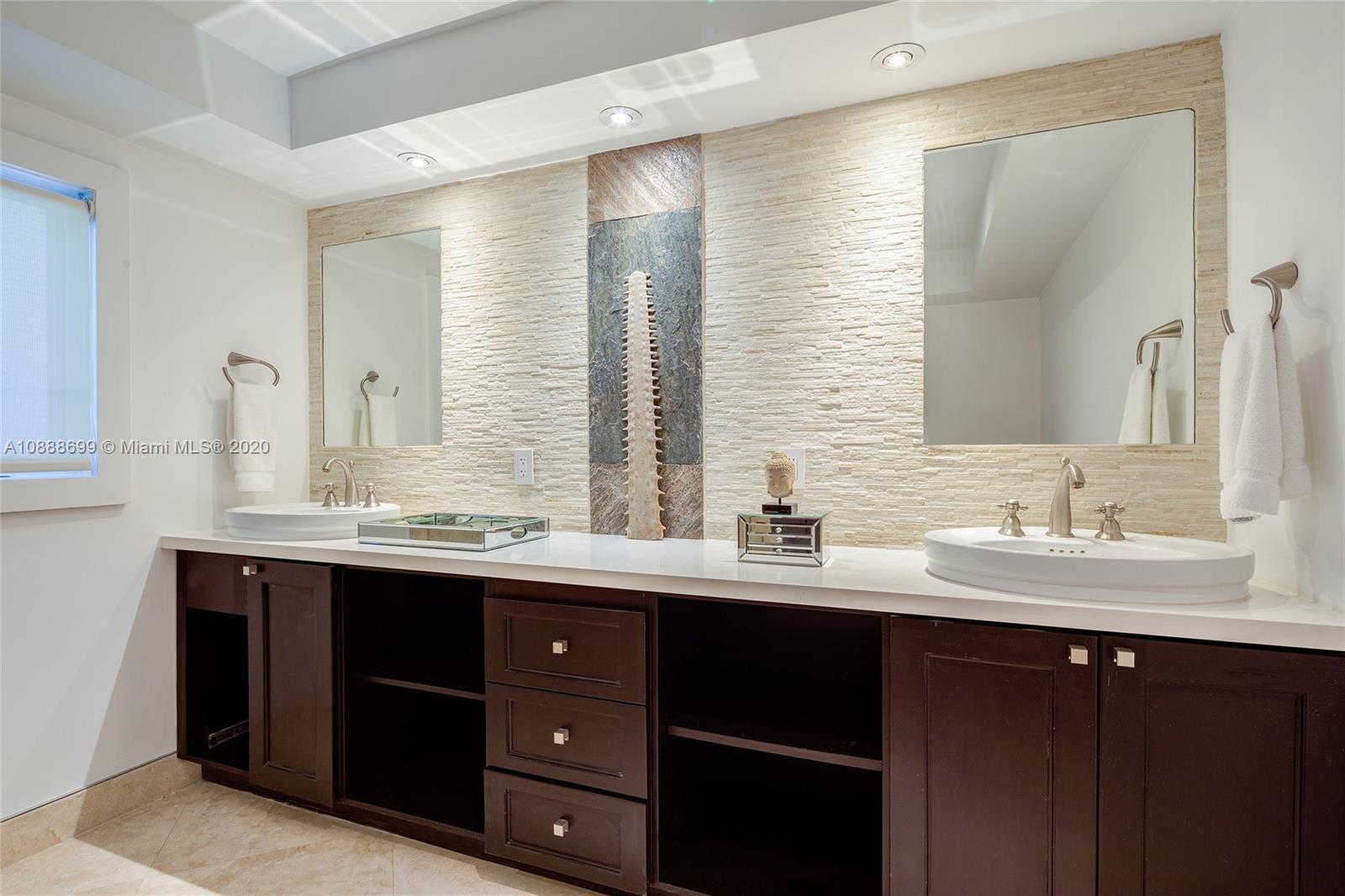 621 Island Road Miami, FL 33137 - Photo 25 of 39 a bathroom with a sink double vanity and a mirror