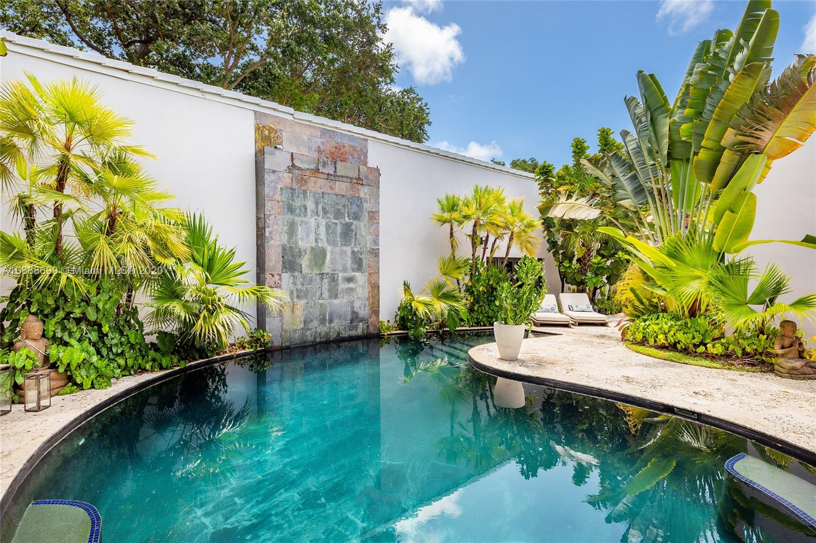 621 Island Road Miami, FL 33137 - Photo 31 of 39 a view of a swimming pool with a patio