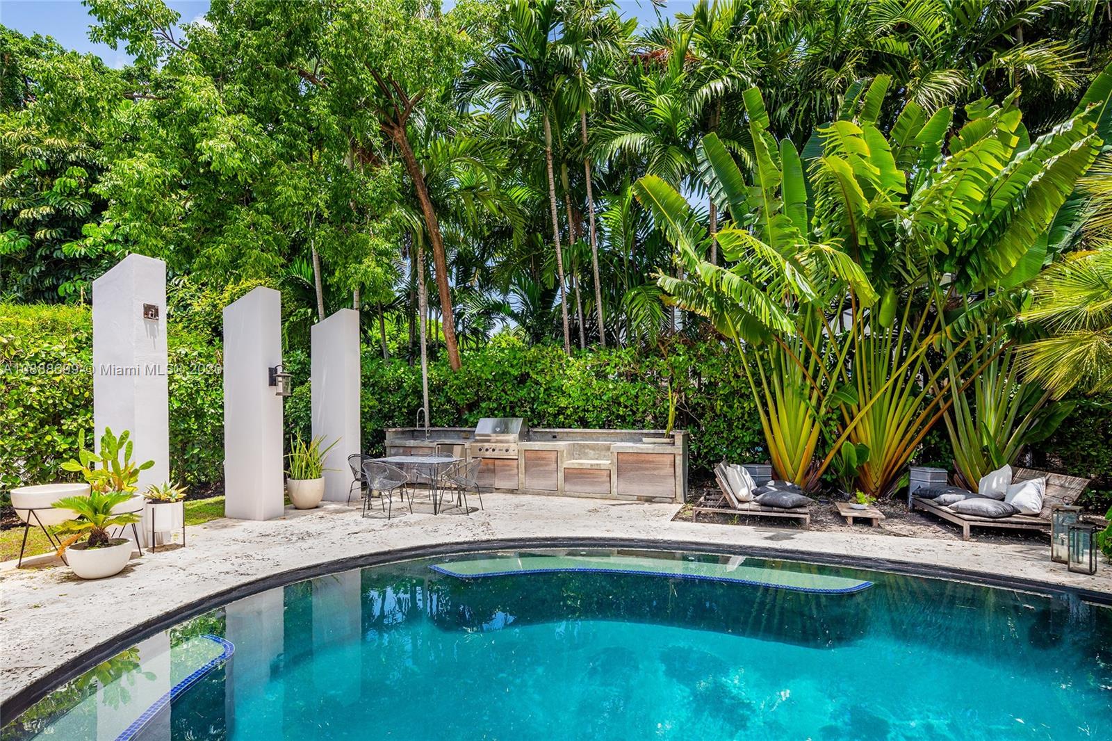 621 Island Road Miami, FL 33137 - Photo 33 of 39 a view of a swimming pool with a patio