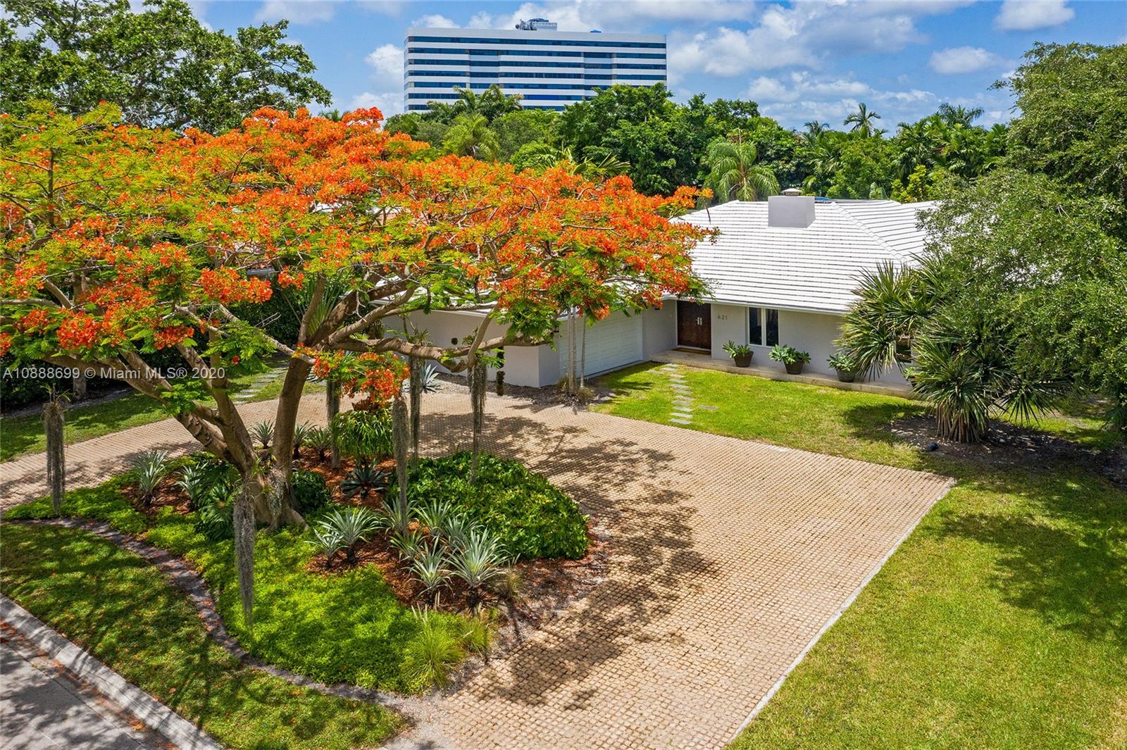 621 Island Road Miami, FL 33137 - Photo 36 of 39 a backyard of a house with a garden and plants