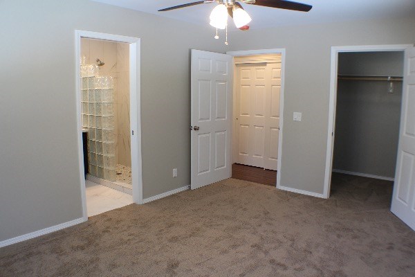 18-7857 Kaniela Road Mountain View, HI 96771 - Photo 13 of 24 an empty room with closet and a chandelier fan