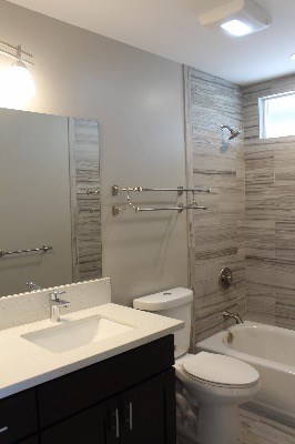 18-7857 Kaniela Road Mountain View, HI 96771 - Photo 17 of 24 a bathroom with a sink a toilet and shower