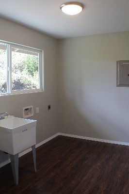 18-7857 Kaniela Road Mountain View, HI 96771 - Photo 18 of 24 a room with a window wooden floor and a sink