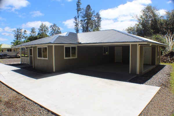 18-7857 Kaniela Road Mountain View, HI 96771 - Photo 20 of 24 a front view of a house with a yard
