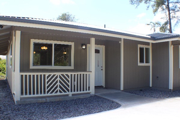 18-7857 Kaniela Road Mountain View, HI 96771 - Photo 5 of 24 a view of wooden house with a porch