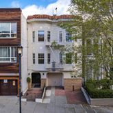 a view of a building with sitting area