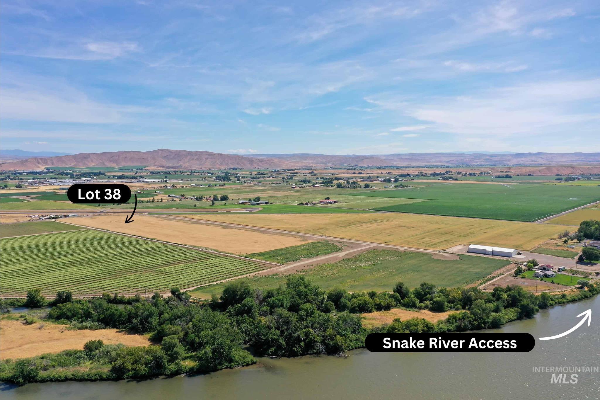 Tbd Tbd Hansen Road Weiser, ID 83672 - Photo 3 of 4 Aerial view of sparsely populated area featuring a mountainous background and large plots for crops
