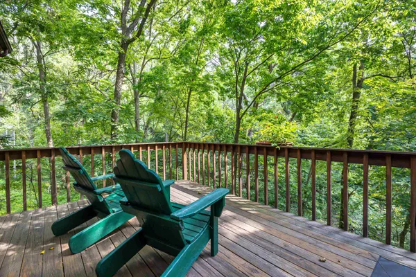 a view of a two chairs in the balcony