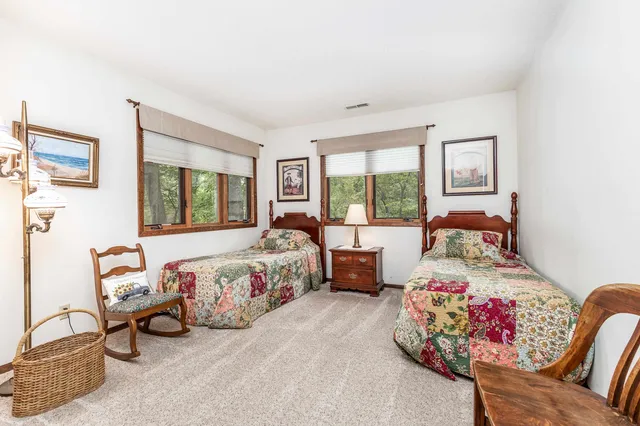 a bedroom with a bed and a couch