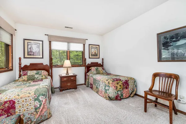 a bedroom with furniture and a window