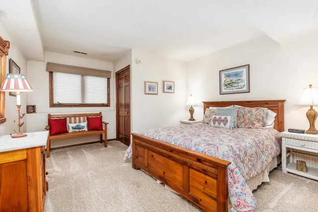 a bed room with a bed and a tv