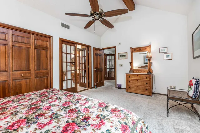 a bedroom with a bed and a dresser