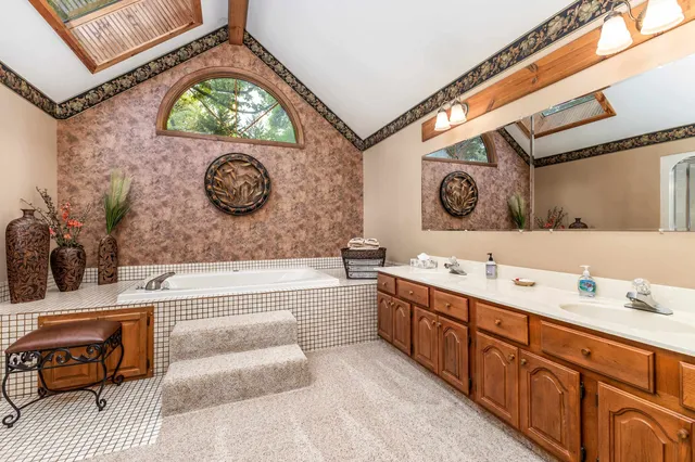 a bathroom with a bathtub and a sink