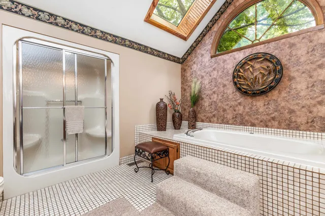 a bathroom with a bathtub and a shower