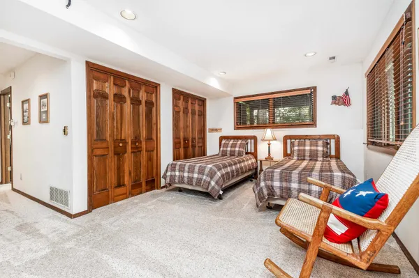 a bedroom with furniture and a bed