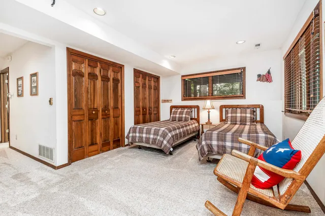 a bedroom with furniture and a bed