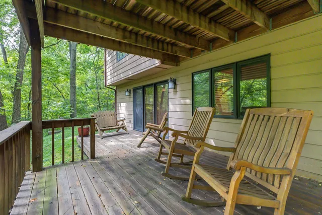 a view of two chairs in the balcony
