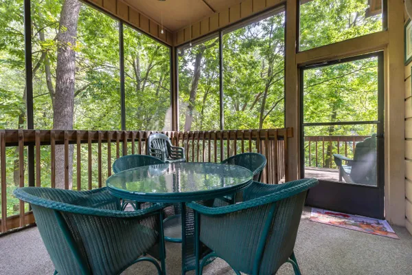 a living room filled with furniture and a potted plant