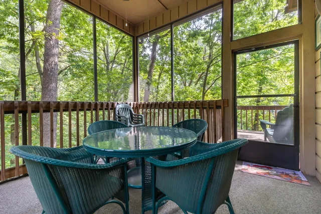 a living room filled with furniture and a potted plant