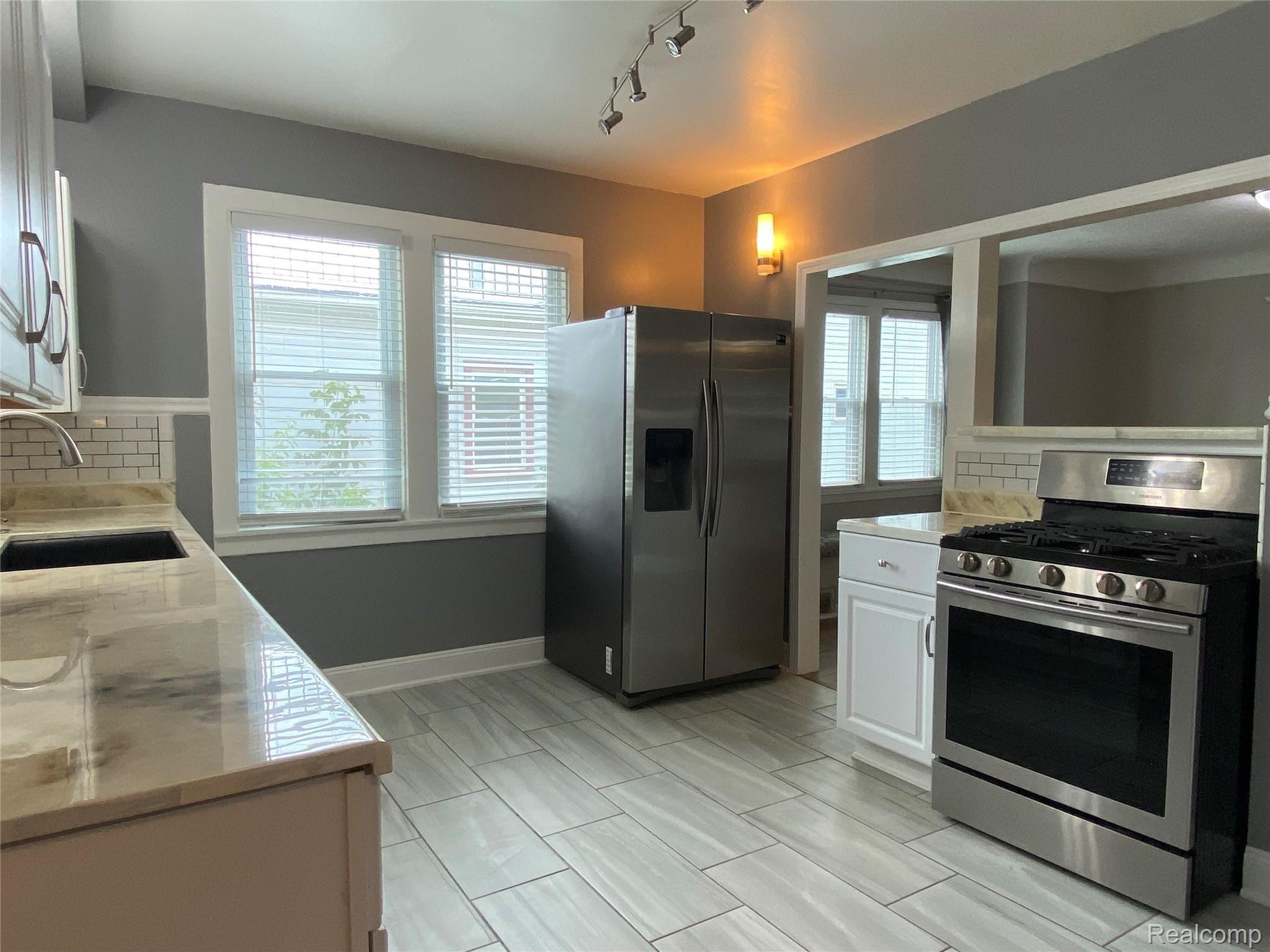 1858 Leitch Road Ferndale, MI 48220 - Photo 9 of 30 Kitchen with Custom Epoxy Counters and Pass through to Dining Room