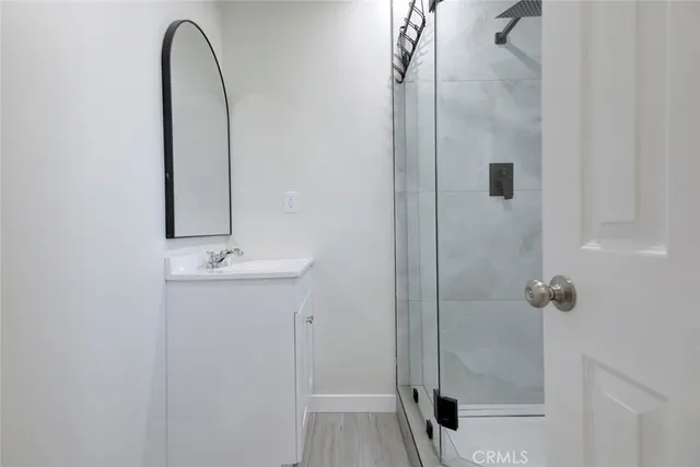 a bathroom with a sink and mirror